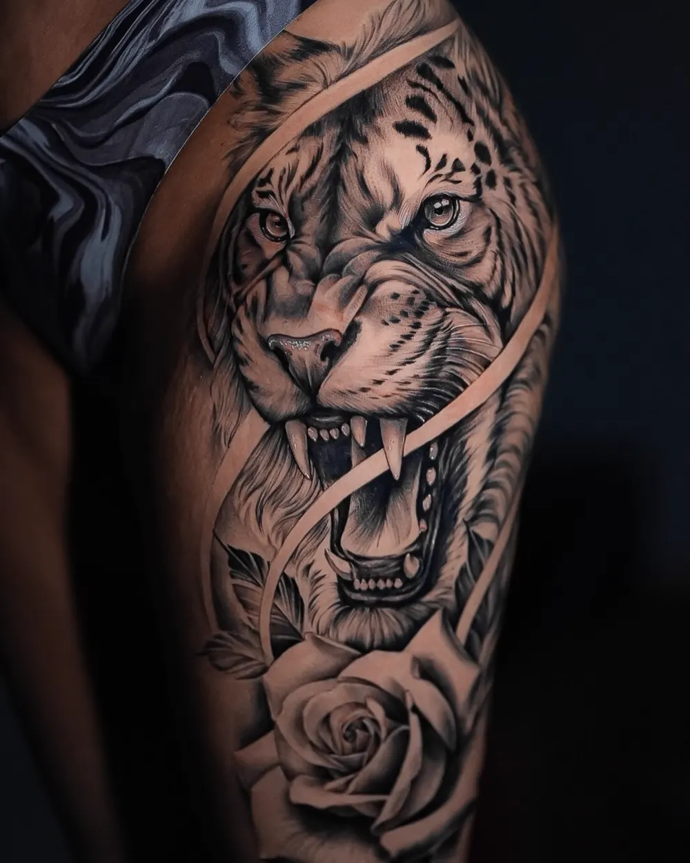 Roaring tiger with rose — black & grey realism tattoo on the upper arm, by Foenix Ink, Hollywood FL (1/2)